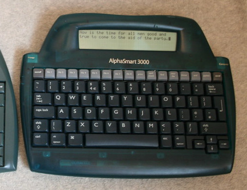  curvey dark gray plastic bodied keyboard device with a thin LCD display