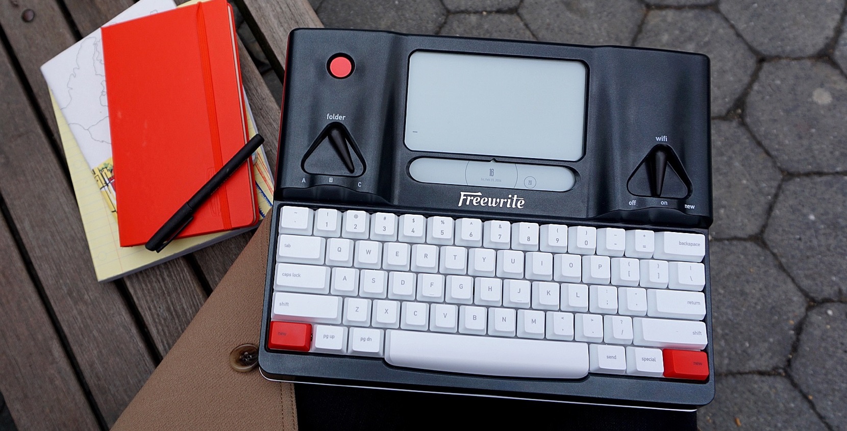 a mechanical keyboard with an attached e-ink screen and prominent physical switches