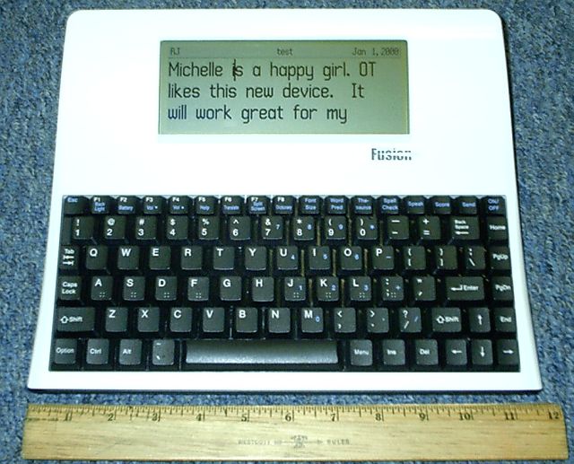 a rectangular 80s looking keyboard contraptio with a big old style lcd display